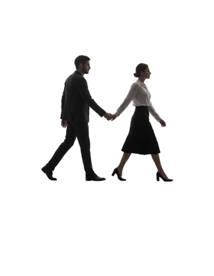 A man and woman walking while holding hands